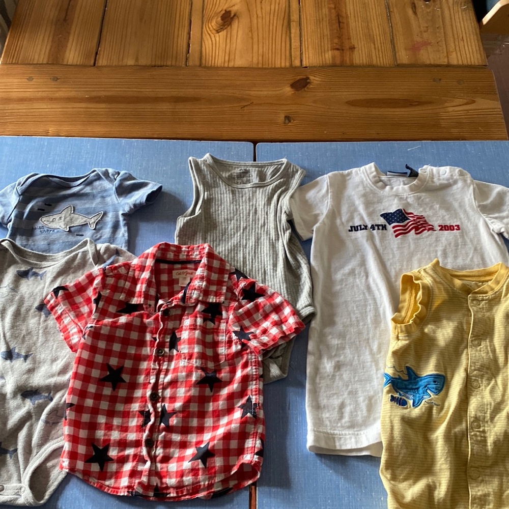 shark  12m button down is 18 m, tank 12-18m, July romper 24m, yellow romper 18m.